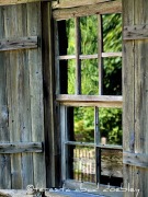 picture of window with wooden shutters and a wooden frame